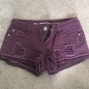 Distressed purple jean shorts